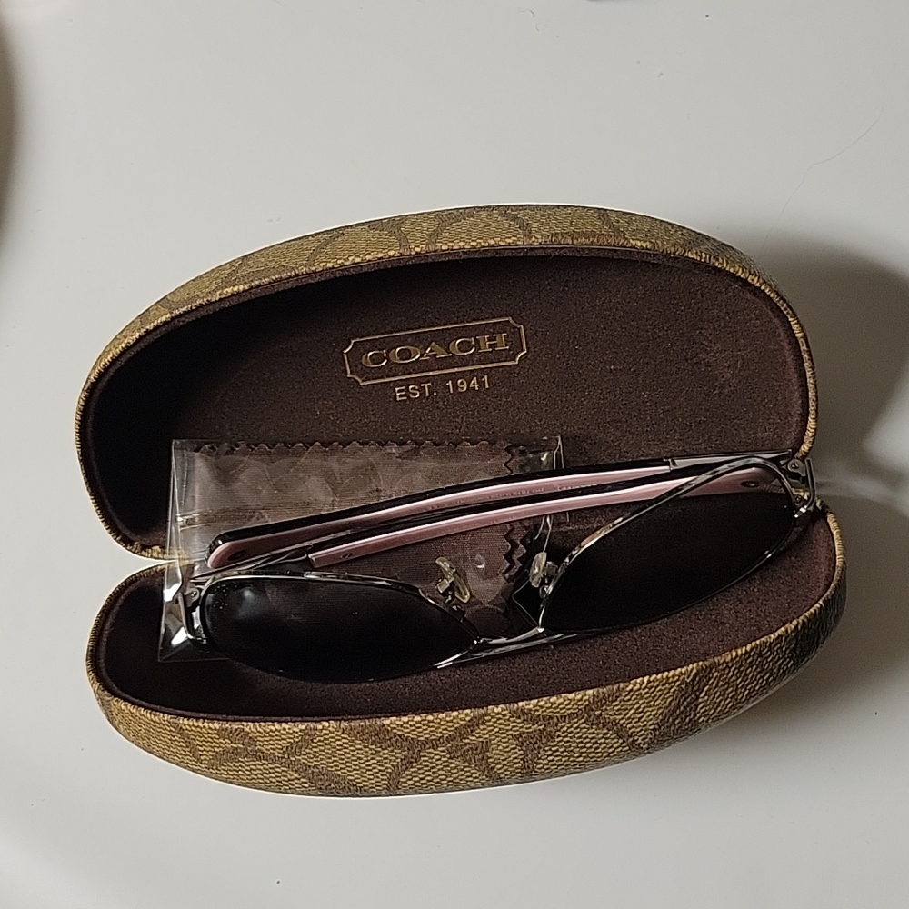 Coach sunglasses, silver color, and pink.